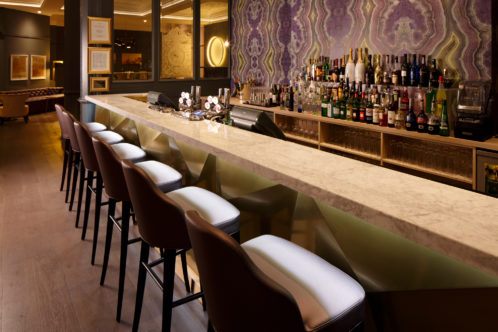 Marco's Bar at Mercure Leicester The Grand Hotel, white and brown leather bar stools at a marble bar