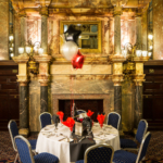 Marble fireplace in The King's Hall at Mercure Leicester The Grand Hotel, with event table in foreground