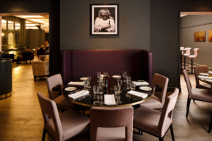 Mercure Leicester The Grand Hotel, Marco's New York Italian Restaurant, dining table with photo of Marco Pierre White above.