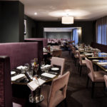 Mercure Leicester The Grand Hotel, Marco's New York Italian Restaurant, leather purple seating and dark grey walls