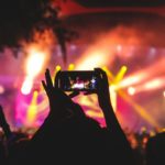 Person taking picture at a gig